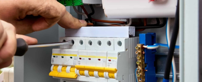 Electrician upgrading a consumer unit