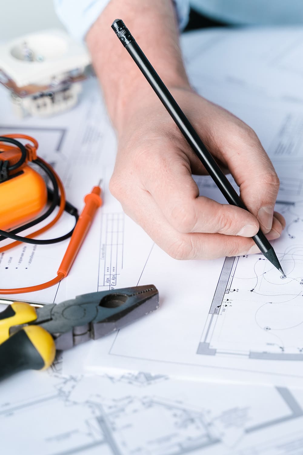 Electrician putting together a house rewire plan.